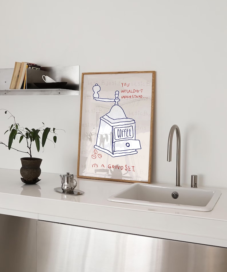 May include: A framed illustration of a coffee grinder with the text "You wouldn't understand... It's a grind set."