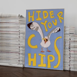 May include: A blue and yellow poster with a seagull in the center. The seagull is white with black eyes and a yellow beak. The poster says "Hide Your Chips".