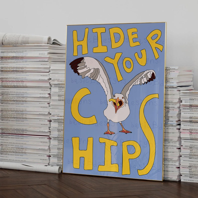 May include: A blue and yellow poster with a seagull in the center. The seagull is white with black eyes and a yellow beak. The poster says "Hide Your Chips".