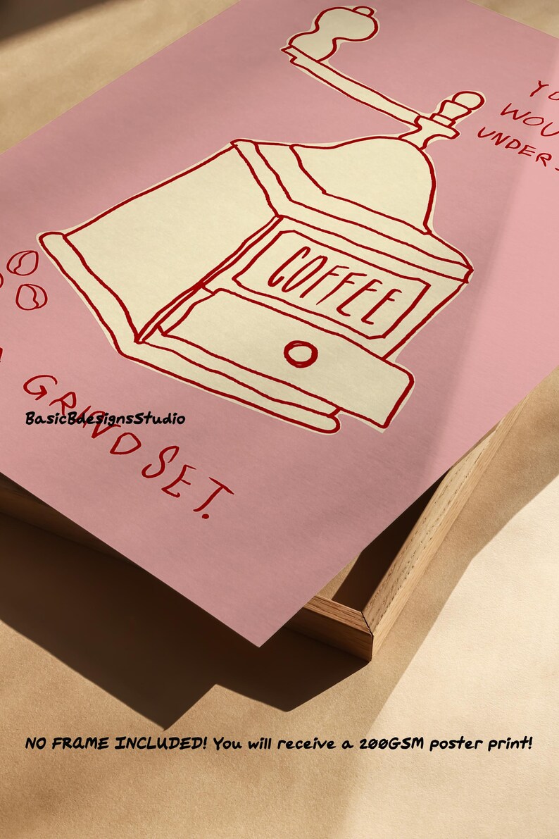 May include: A pink poster with a red illustration of a coffee grinder with the text "COFFEE" on it. The text "GRIND SET" is written in red at the bottom of the poster.