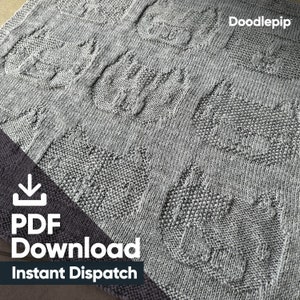 May include: A gray knitted blanket with a repeating pattern of cat faces. The blanket has a textured appearance and the text "Doodlepip" is in the upper right corner. The words "PDF Download Instant Dispatch" are in the lower left corner.