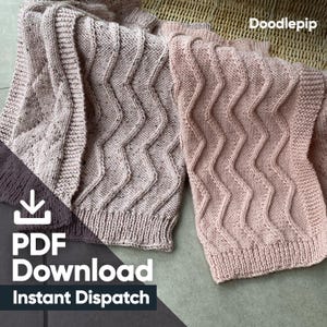 May include: Two pink knitted blankets with a wavy stitch pattern. The blankets are folded and displayed on a textured surface. The text "PDF Download Instant Dispatch" is visible in the lower left corner of the image.