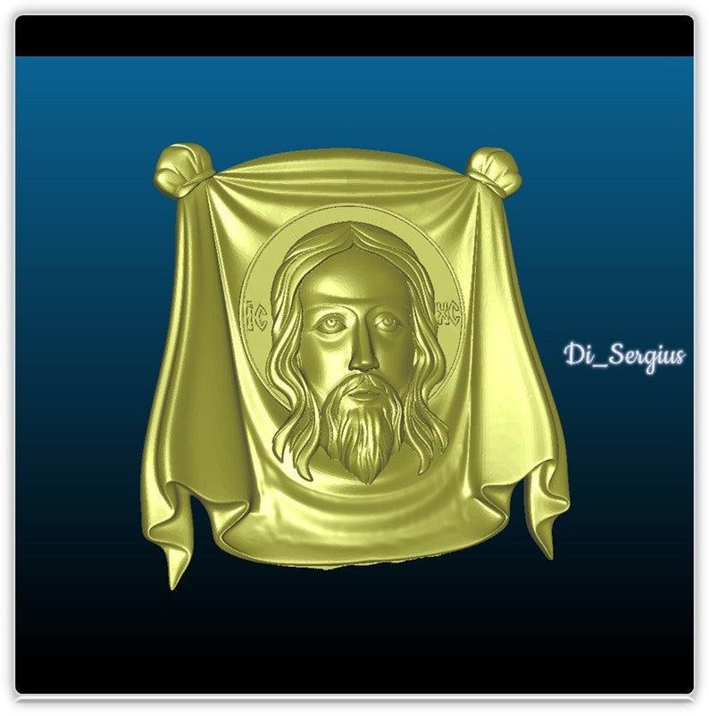 May include: A gold-colored, three-dimensional relief sculpture of Jesus Christ's face. The face is surrounded by a draped cloth with a knot at the top.