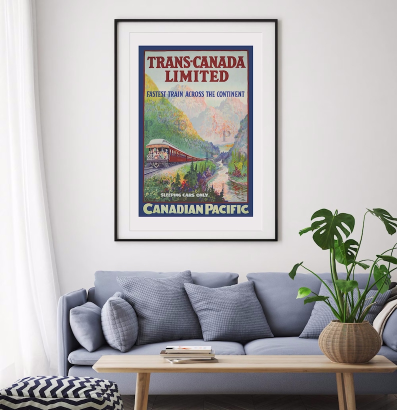 May include: A framed vintage travel poster for Trans-Canada Limited, featuring a red train traveling through a mountain landscape. The poster includes the text "Fastest Train Across the Continent" and "Canadian Pacific."