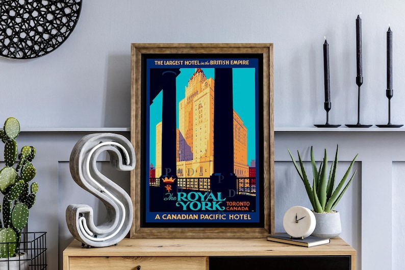May include: Vintage travel poster advertising The Royal York Hotel in Toronto, Canada. The poster features a large illustration of the hotel with the text "The Largest Hotel in the British Empire" and "A Canadian Pacific Hotel".