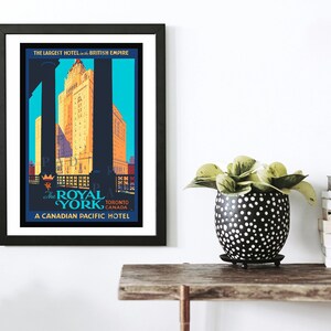 May include: Vintage travel poster advertising The Royal York Hotel in Toronto, Canada. The poster features a blue, yellow, and red color scheme with a black silhouette of the hotel building. The text reads "The Largest Hotel in the British Empire" and "A Canadian Pacific Hotel."