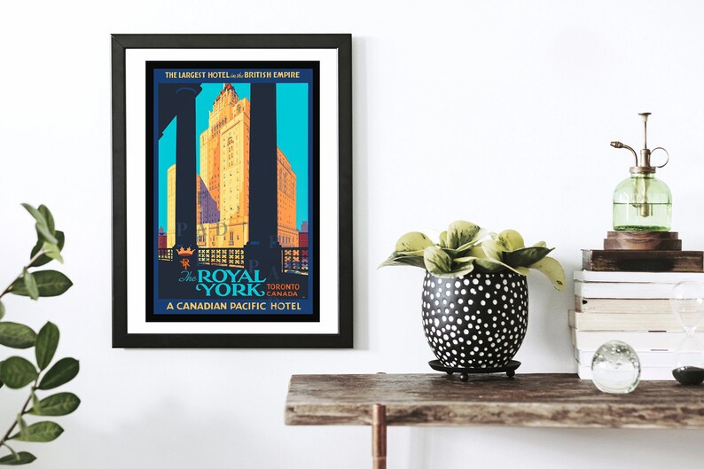 May include: Vintage travel poster advertising The Royal York Hotel in Toronto, Canada. The poster features a blue, yellow, and red color scheme with a black silhouette of the hotel building. The text reads "The Largest Hotel in the British Empire" and "A Canadian Pacific Hotel."