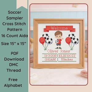 May include: A framed cross-stitch sampler with a soccer theme. The design includes a child holding a soccer ball, soccer ball balloons, and the word "Welcome." The sampler is 15 inches by 15 inches.