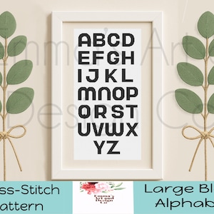 May include: A framed cross-stitch pattern featuring a large block alphabet in black on a white background. The frame is white, and the image is flanked by decorative green leaf branches tied with twine bows. The text "Cross-Stitch Pattern" and "Large Block Alphabet" are at the bottom.