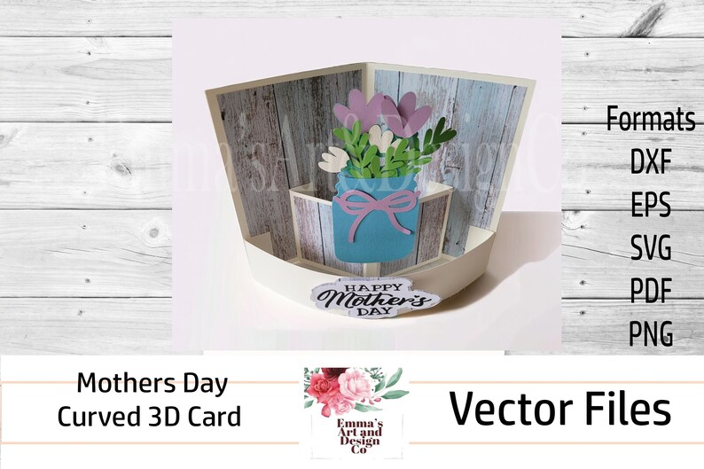 May include: A 3D curved card for Mother's Day with a woodgrain background. The card features a blue mason jar with a pink bow and a bouquet of pink and white flowers. The card also includes the text "Happy Mother's Day".