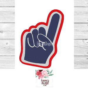 May include: A blue foam finger with a red outline, pointing up with the index finger extended. The finger is a common sports cheering item.