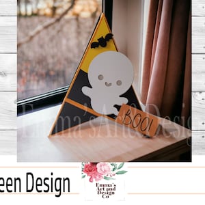 May include: A yellow and black triangle-shaped Halloween decoration with a ghost and the word "BOO!" on a wooden sign.