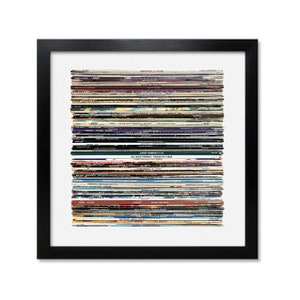 May include: A stack of vintage vinyl records with various album covers and titles. The stack is arranged vertically and includes albums by artists such as Johnny Ramone, Gil Scott-Heron, and The Stranglers.