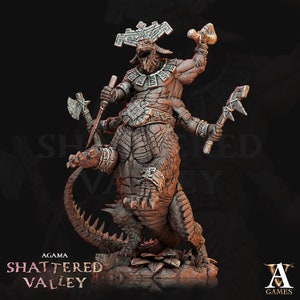 May include: A detailed miniature figurine of a four-armed, reptilian creature riding a larger, scaled reptile. The creature is wearing a headdress and armor, and is holding weapons in each hand. The figurine is painted in shades of brown and gray.