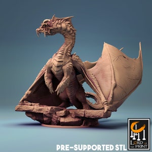 May include: A 3D printed model of a red dragon with wings spread, standing on a rocky base. The model is pre-supported and ready to be printed.