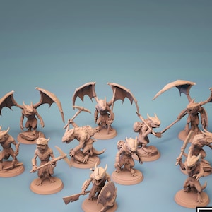 May include: A collection of miniature fantasy figurines. The figures are in various poses, some with wings, weapons, and armor. The color is a light brown, and they are set against a light blue background. The figurines are likely for tabletop gaming or collecting.