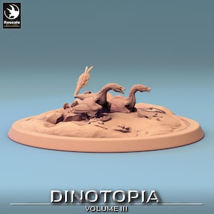 May include: Two brown, prehistoric bird-like creatures with long necks and beaks are perched on a sandy base. The base is surrounded by a raised rim. The creatures are facing different directions. The base is labeled "Dinotopia Volume III".