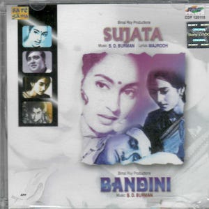 Może przedstawiać: Pudełko na płytę CD z tytułami filmów "Sujata" i "Bandini". Okładka zawiera zdjęcia aktorów i aktorek. Pudełko na płytę CD ma przezroczystą plastikową osłonę z tekstem "Sare Gama" i "Sony DADC".