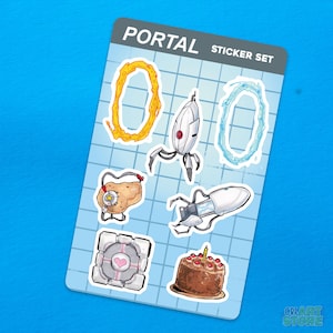 May include: A sticker set featuring designs from the video game Portal. The set includes stickers of portals, a robot, a companion cube, and a cake. The text "PORTAL STICKER SET" is at the top of the sheet. The background is a light blue grid.