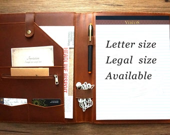 May include: A brown leather portfolio with a zippered pocket, a flap with a snap closure, and a pen holder. The portfolio has a notepad with lined paper and the text "VERITAS" and "Letter size Legal size Available".