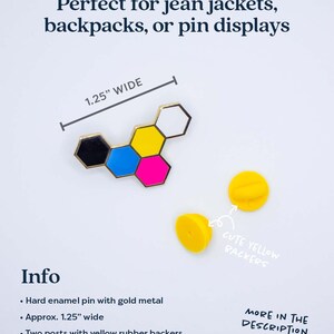 May include: A hard enamel pin with gold metal and a colorful geometric design, approximately 1.25 inches wide. Includes two yellow rubber backer posts. Text on the image reads "Perfect for jean jackets, backpacks, or pin displays."