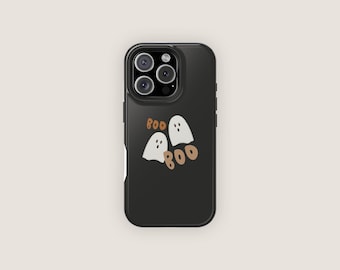 May include: A black smartphone case featuring a graphic design of two white ghosts and the brown text BOO BOO. The case has a cutout for a triple camera system on the back, with a raised border around the lenses and a smooth, matte finish surface.