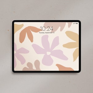 May include: A digital tablet with a white background and an abstract floral design in shades of pink, brown, and beige. The time is 10:24 and the date is Tuesday, September 13.