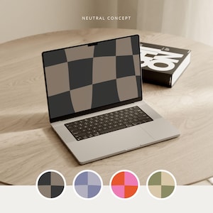May include: A silver laptop computer with a black and brown checkered pattern on the screen. The laptop is open and sitting on a wooden table. The laptop is next to a closed book with the word "No" printed on the cover.