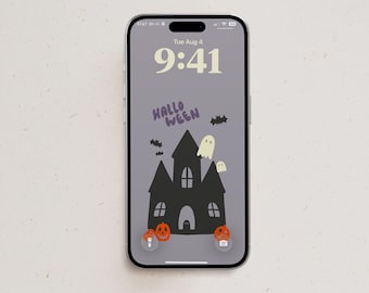 May include: A smartphone displaying a lock screen with a gray background, the time 9:41, and the date Tue Aug 4. The screen features a black haunted house illustration, two white ghosts, black bats, orange jack-o'-lanterns, and the text HALLOWEEN.