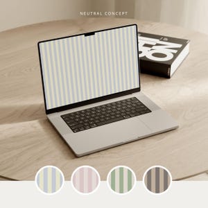 May include: A silver laptop with a black keyboard displays a screen with vertical light blue and cream stripes. The text NEUTRAL CONCEPT appears above the screen. Four circular swatches below show stripe patterns in blue, pink, green, and brown.