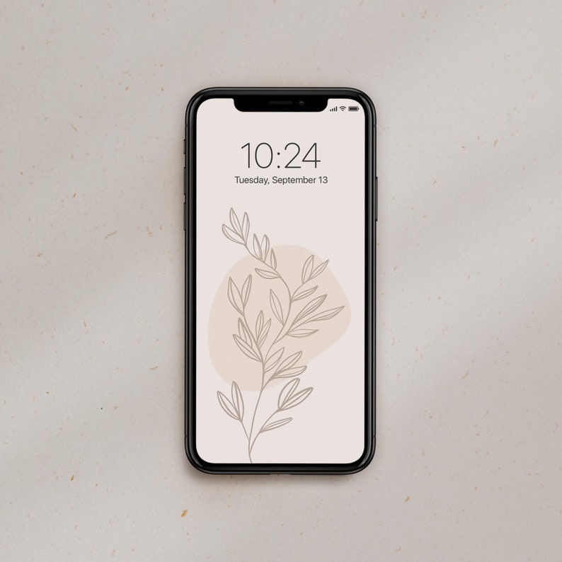 May include: A black smartphone with a white background and a simple line drawing of a plant with a light brown circle behind it. The time is 10:24 and the date is Tuesday, September 13.