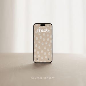 Puede incluir: Un tel&eacute;fono inteligente con un fondo de color neutro y un patr&oacute;n de fantasmas blancos. La hora es 10:49. El texto "NEUTRAL CONCEPT" est&aacute; en la parte inferior de la imagen.