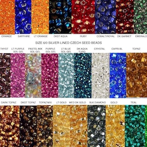 May include: A collection of size 6/0 silver-lined Czech seed beads in various colors, including sapphire, orange, ruby, emerald, and topaz. The image displays a wide array of colors and bead types, with text labels identifying each color.