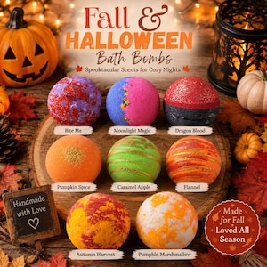 May include: Eight spherical bath bombs arranged on a wooden surface. The bombs feature various colors and textures, labeled Bite Me, Moonlight Magic, Dragon Blood, Pumpkin Spice, Caramel Apple, Flannel, Autumn Harvest, and Pumpkin Marshmallow.