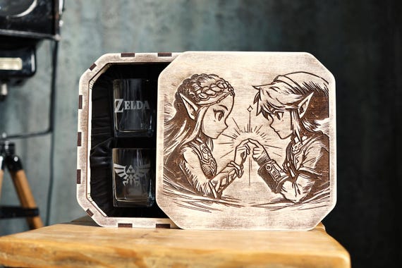 A Legend of Zelda–themed engraved whiskey decanter set in a wooden fantasy box — wildly specific, visually striking, and 200 hearts prove the demand.