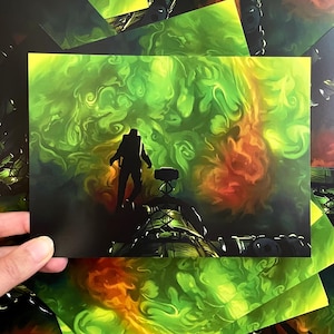 May include: A rectangular art print featuring a dark silhouette of a figure standing on a metallic structure against a swirling, vibrant background of bright lime green and orange smoke-like clouds, with a small mechanical device in the foreground.
