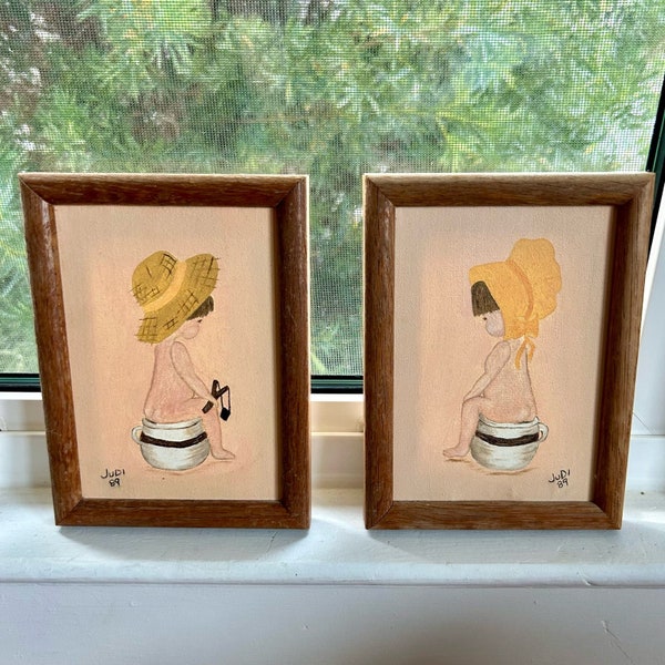 Vintage Framed Paintings Boy And Girl on Chamber Pots, Handmade Art Paintings set of 2