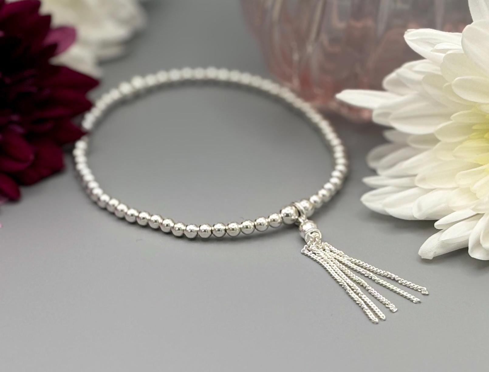 Silver bracelet with tassel discount