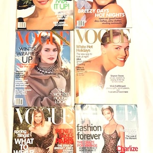 May include: A selection of vintage Vogue magazines, displaying fashion and lifestyle content. The covers feature models and celebrities, with striking typography and vibrant colours, reflecting various fashion trends.