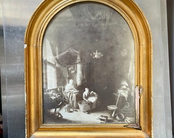 May include: A framed black and white print of a painting depicting a woman sitting in a chair and another woman standing by a basket with a baby inside. The painting is set in a room with a window and a chandelier.