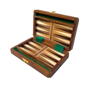 May include: A wooden backgammon game set with a brown wood exterior and a green felt interior. The game board is made of different types of wood, creating a unique pattern.