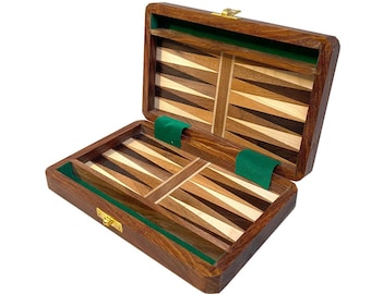 May include: A wooden backgammon game set with a brown wood exterior and a green felt interior. The game board is made of different types of wood, creating a unique pattern.