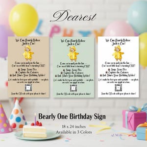 May include: Three "Bearly One Birthday Sign" prints, each with a watercolor bear in a yellow raincoat. The signs read "We Can Bearly Believe Jach is One!" and include a QR code. The sign is 18 x 24 inches and available in 3 colors.