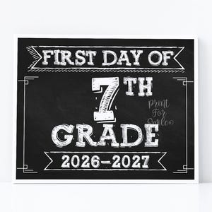 May include: A rectangular chalkboard-style sign with white text and graphics. The text reads FIRST DAY OF 7TH GRADE 2026-2027. The design features a black background with white chalk-style lettering, banners, and decorative border lines.