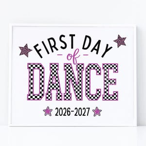 May include: A white rectangular sign featuring the black text FIRST DAY, the purple text of, and the word DANCE in a black and white checkered pattern with a purple outline. Two purple leopard print stars and two solid purple stars frame the text.