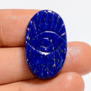 Cabochon ovale di lapislazzuli Occhio di cristallo di lapislazzuli blu intagliato Occhio di cristallo curvo blu 26X16X5 mm Pietra intagliata (retro piatto entrambi i lati lucidati