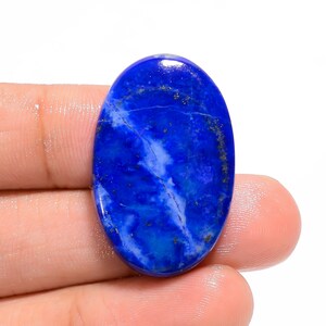 Lapislazzuli Cabochon Pietra preziosa Forma ovale Pietra blu reale Liscia Piatta Nera Lucida Lapislazzuli Pietra preziosa 37 carati 30X19X5 mm