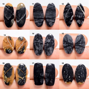 May include: Set of 10 pairs of oval and teardrop shaped cabochons, featuring a black and white dendritic agate pattern. The cabochons are polished and have a smooth, glossy finish.