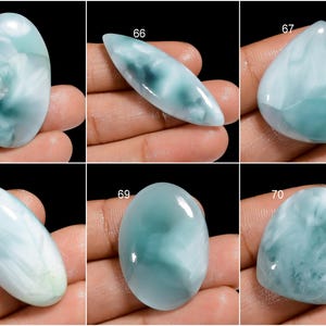 May include: Six oval and teardrop shaped cabochons of blue and white  cabochon gemstones. The stones are numbered 65, 66, 67, 68, 69, and 70.