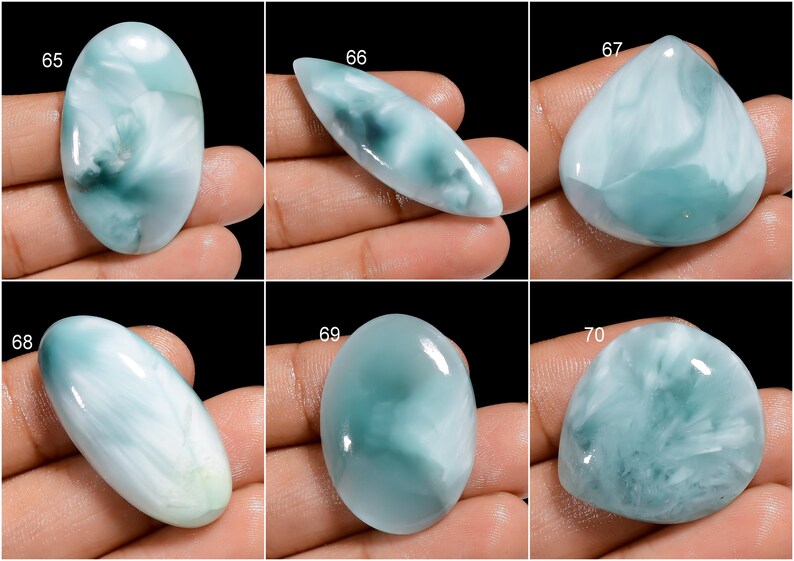 May include: Six oval and teardrop shaped cabochons of blue and white  cabochon gemstones. The stones are numbered 65, 66, 67, 68, 69, and 70.